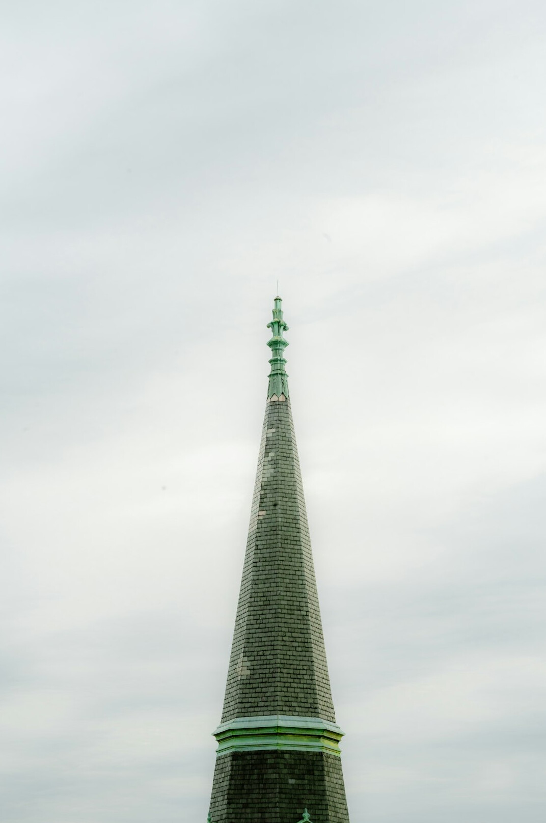 Historic church spire against a grey Danish sky