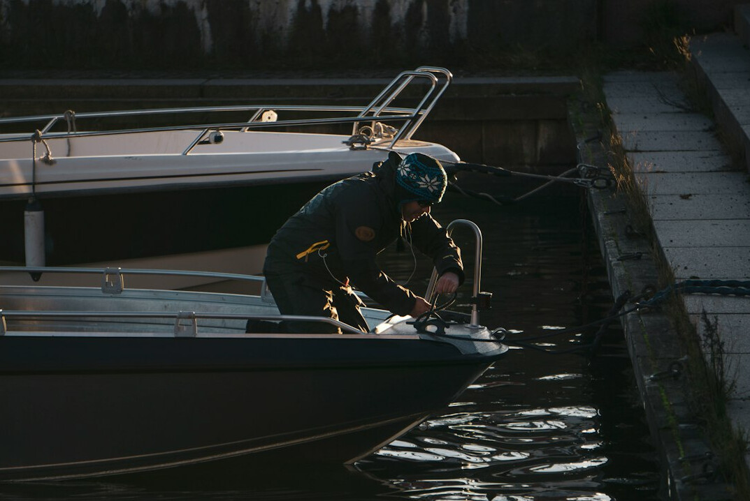 fisherman preparing boat at harbor